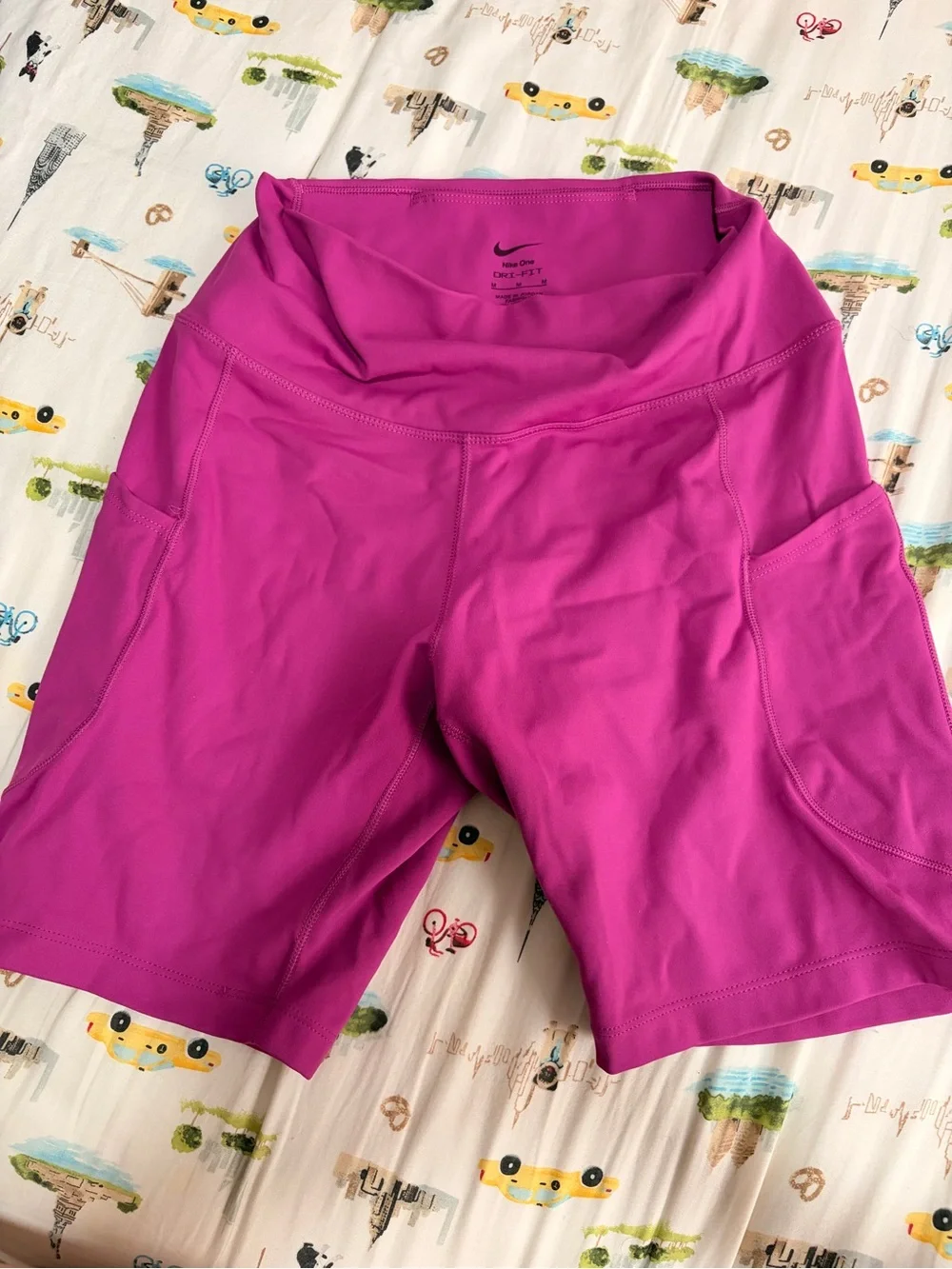 Nike Women's Magenta High-Rise Bike Shorts with Pockets and Reflective Swoosh